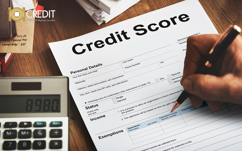 Person filling out a credit score form.