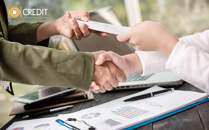 Client receiving loan funds after approval.