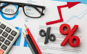Financial charts and interest rate symbols illustrating loan impacts.
