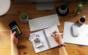 Man calculating his personal finances and savings.